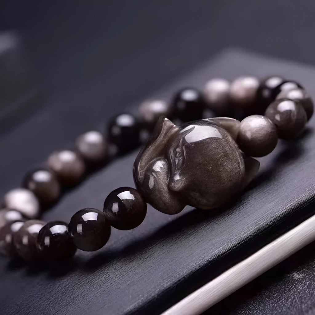 Obsidian gemstone bracelet with 8mm fox head pendant and adjustable knot closure