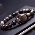 Obsidian gemstone bracelet with 8mm fox head pendant and adjustable knot closure