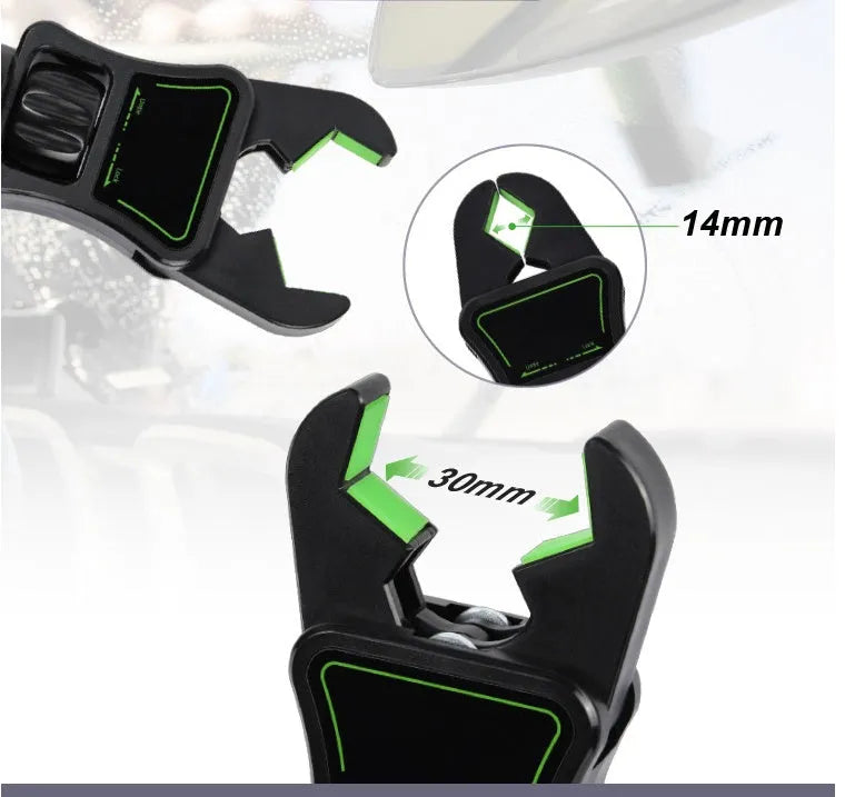 Black and green car phone holder attached to rear view mirror bracket