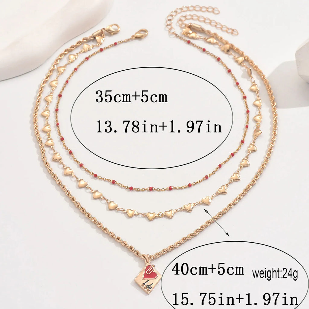 Geometric three-layer heart pendant on an adjustable zinc alloy clavicle chain necklace.