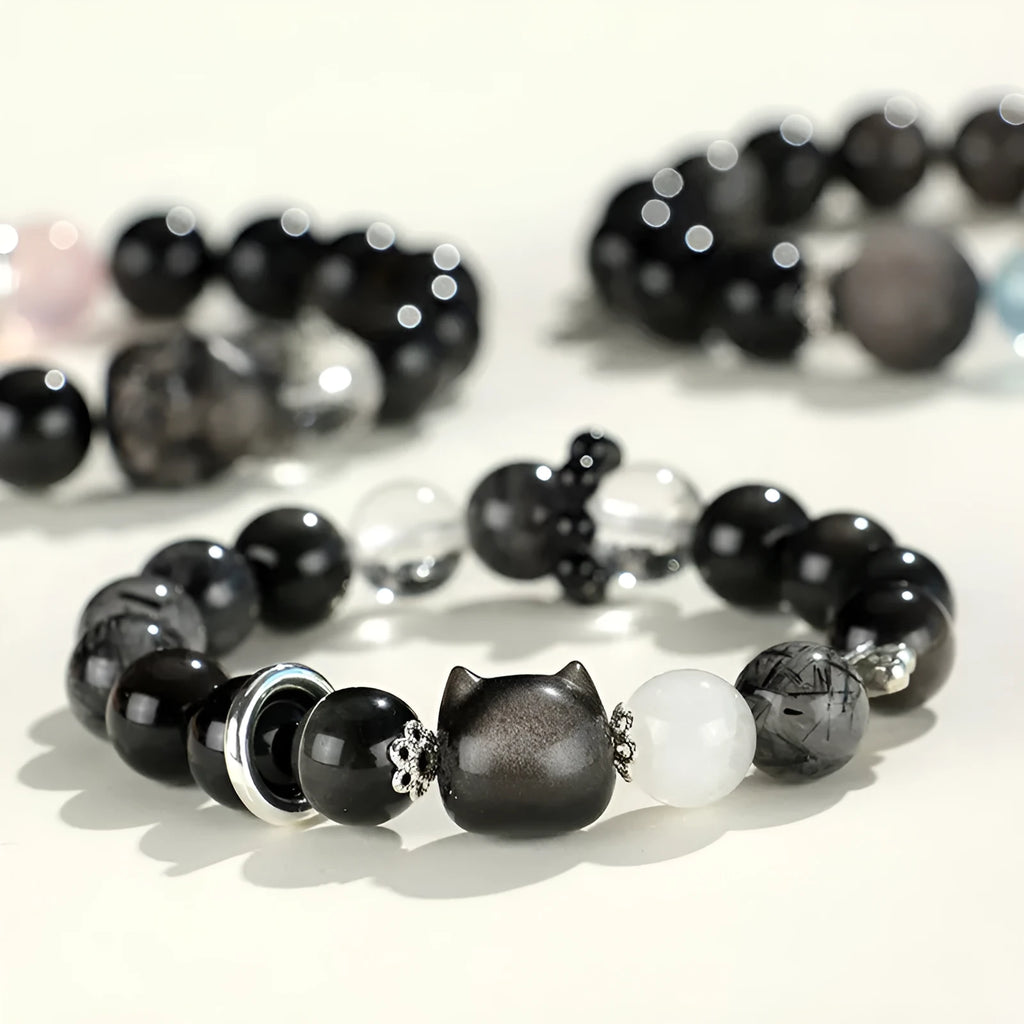 Silver stone bracelet with fox charm and pink, navy blue, black, snowflake ghost crystals.