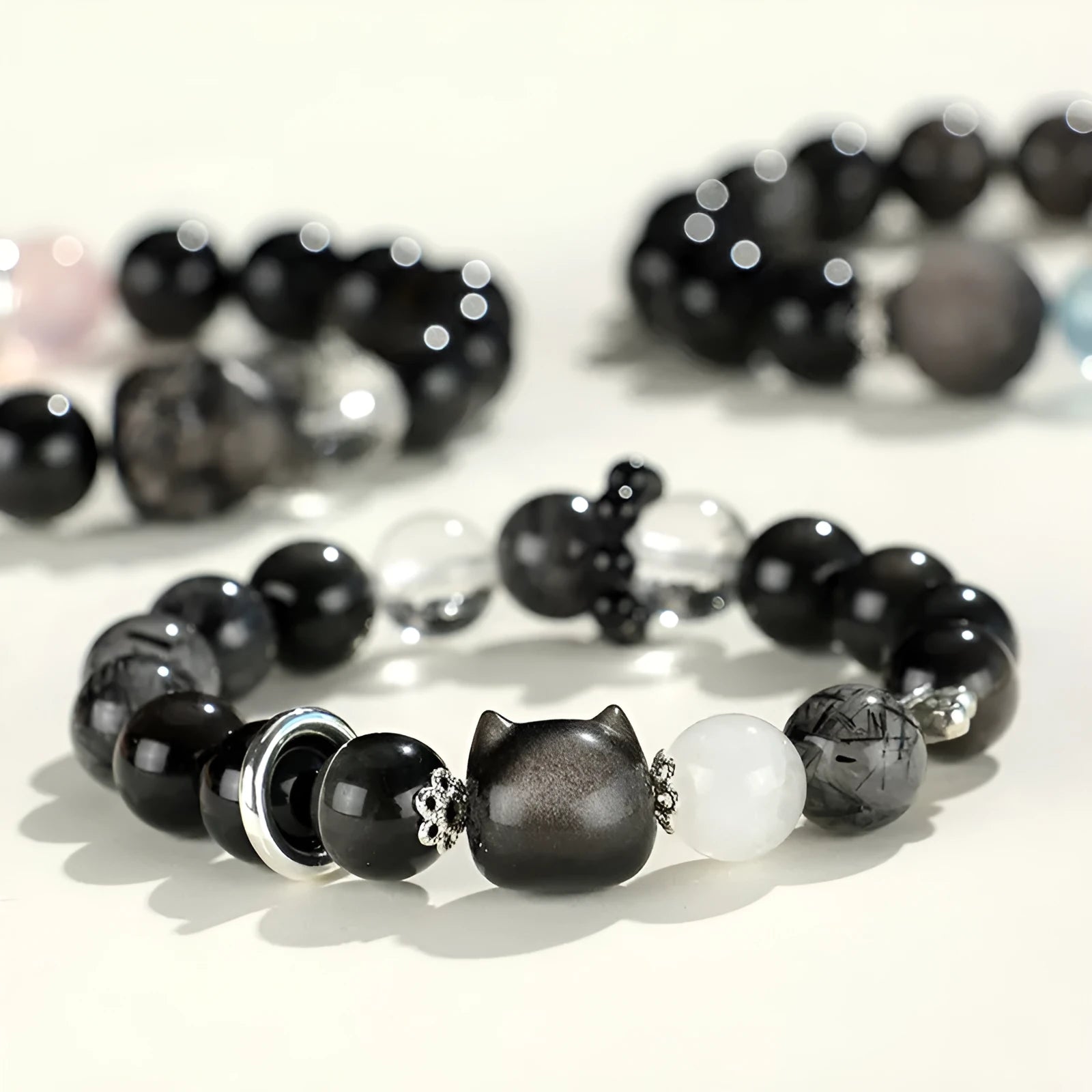 Silver stone bracelet with fox charm and pink, navy blue, black, snowflake ghost crystals.