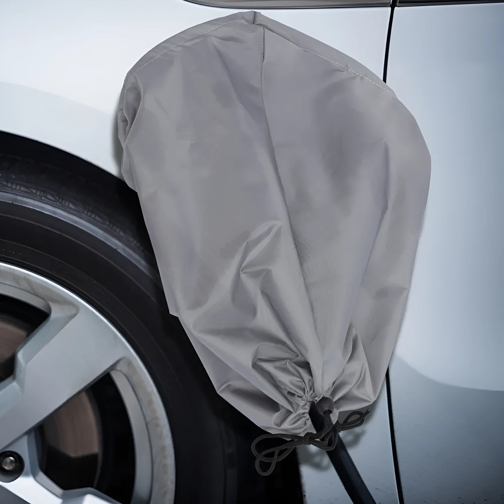 Grey waterproof drawstring bag cover for electric vehicle charging connector.