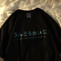 Man modelling a loose-fit black cotton T-shirt with a white letter print on the front.