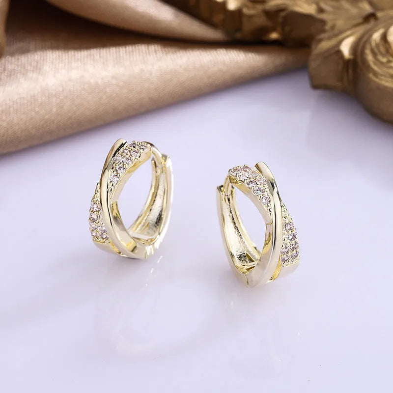 Geometric stud earrings with 14K yellow gold plating and zircon accents on copper base