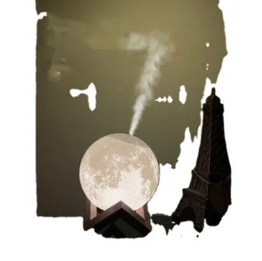 Spherical white lunar humidifier and night light with USB charging port and soft LED glow.