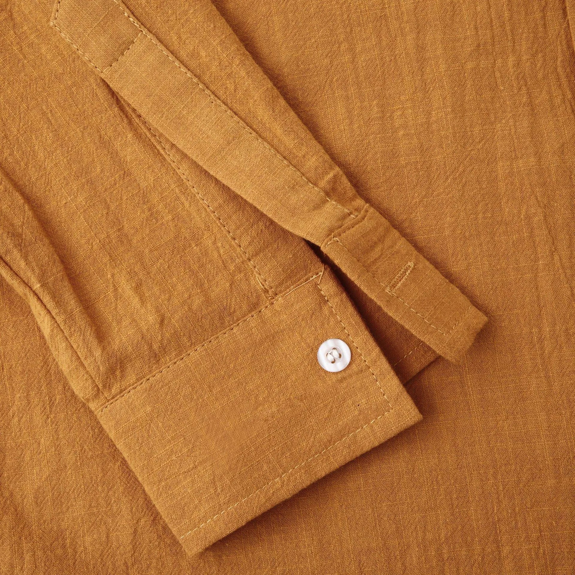 Men's slim fit brown long sleeve shirt and casual pants on a hanger