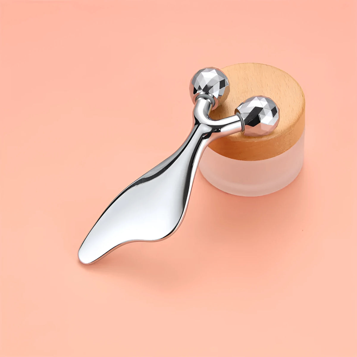 Silver double-roller metal back scratcher massage stick with anion function, supplied in an OPP bag