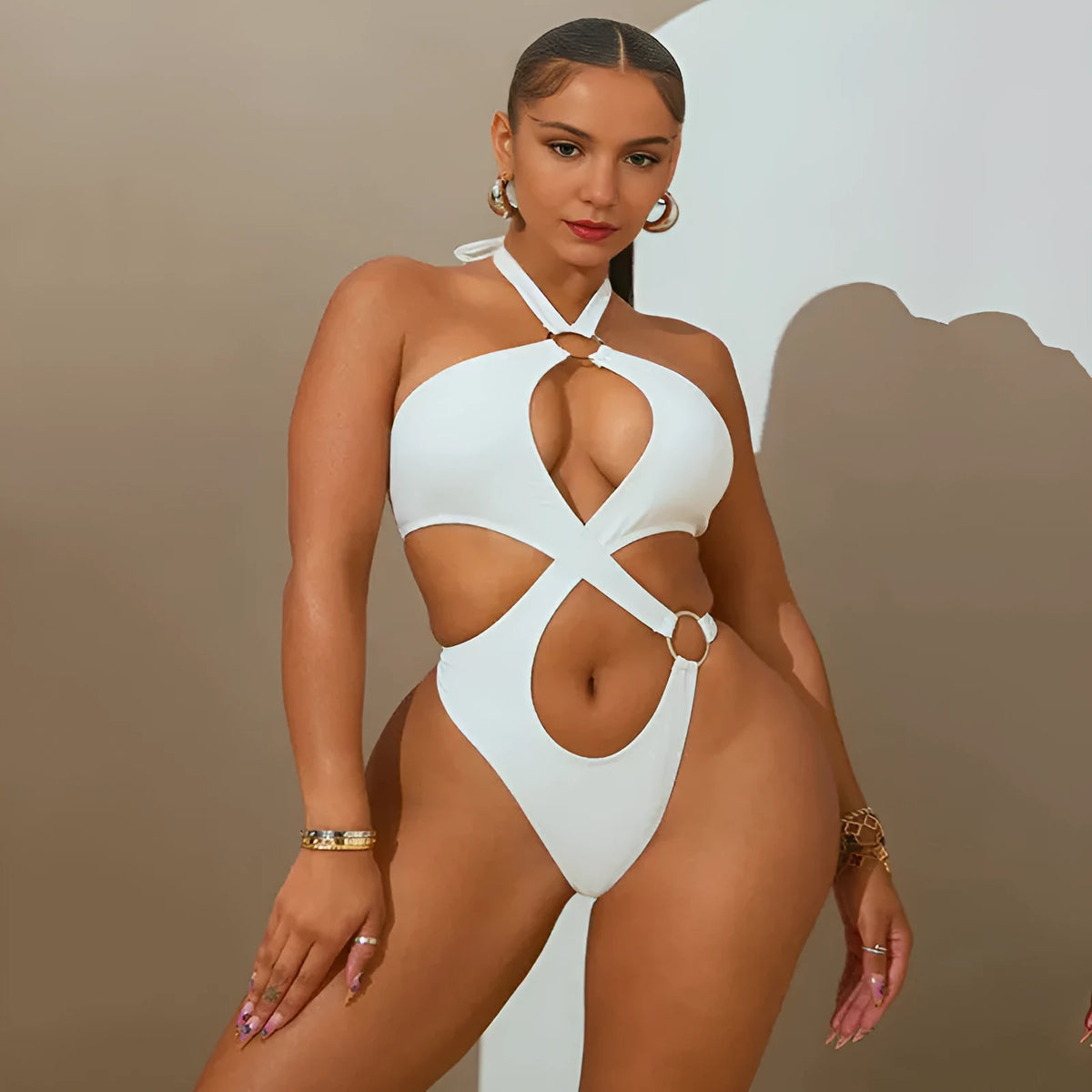 Women's white sleeveless jumpsuit with back lace-up detail and tapered short pants