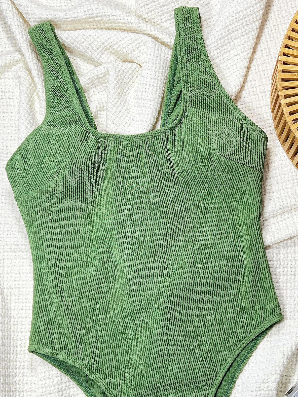 Women's solid green one-piece swimsuit in polyester, available in sizes S, M and L for swimming and wading