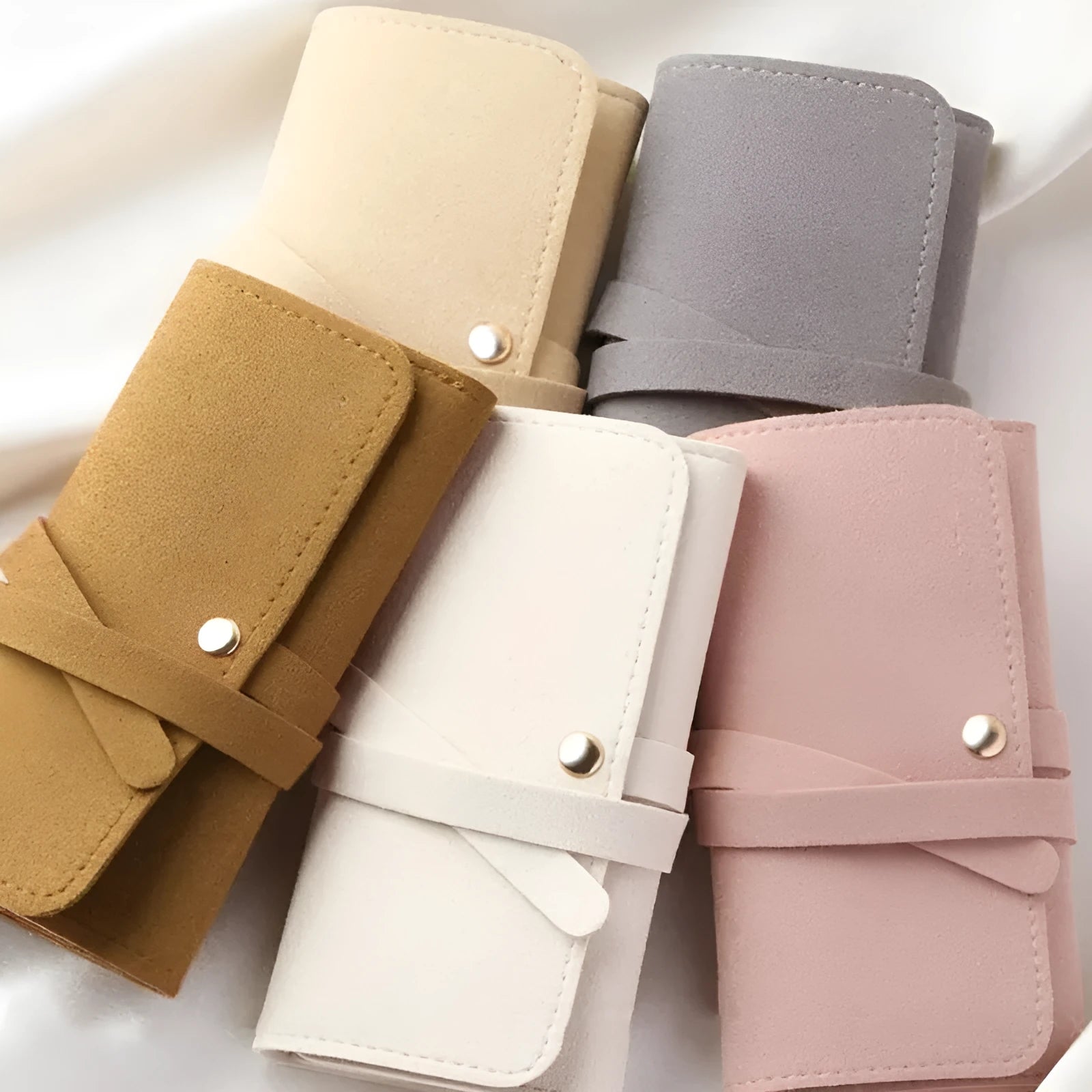 Square brown leather jewellery storage bag measuring 12x12cm for earrings and watches.