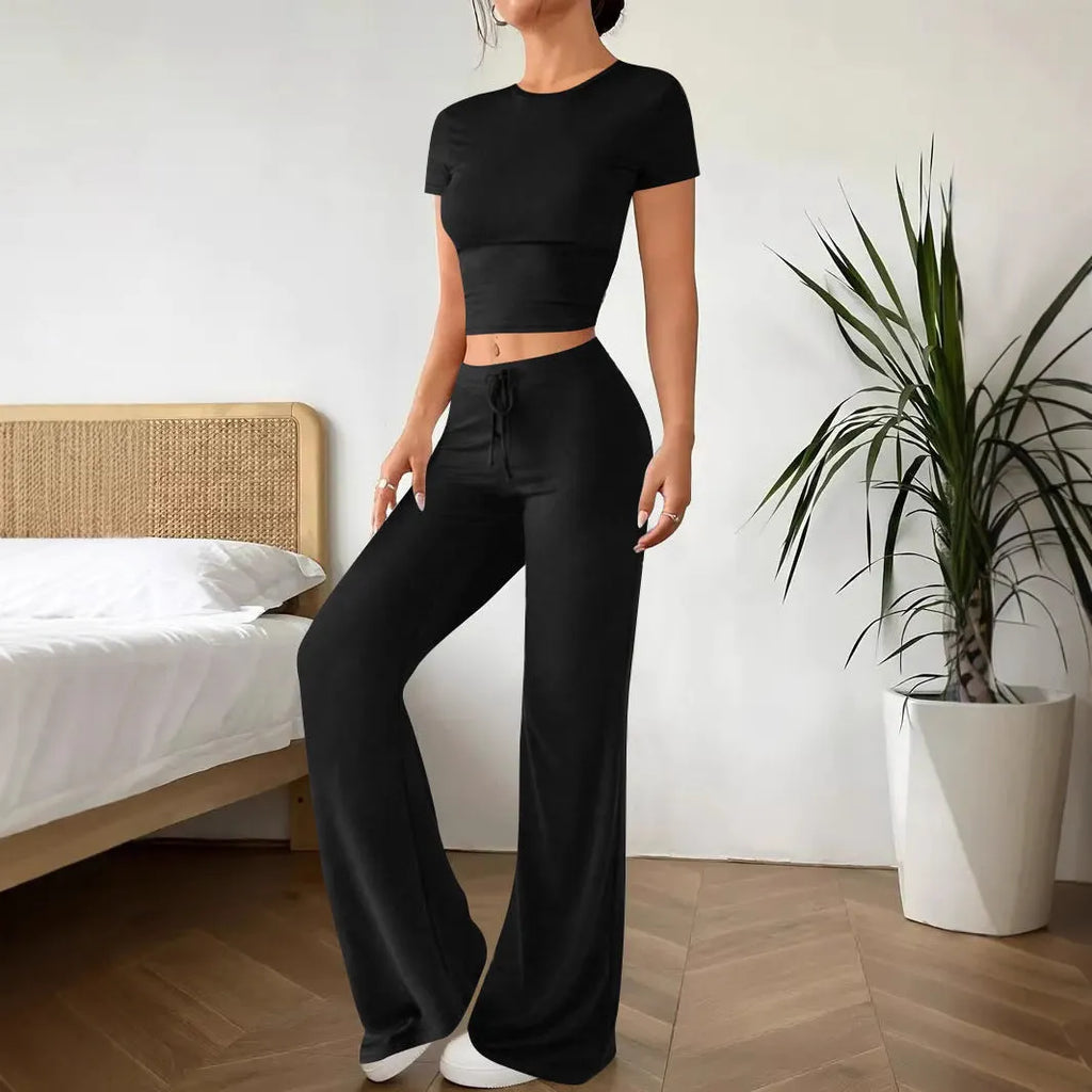 Black high waist trousers and short sleeve t-shirt suit set on a hanger