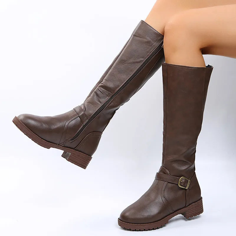 Women's black knight high boots with a square heel and a front belt buckle detail on a round toe.