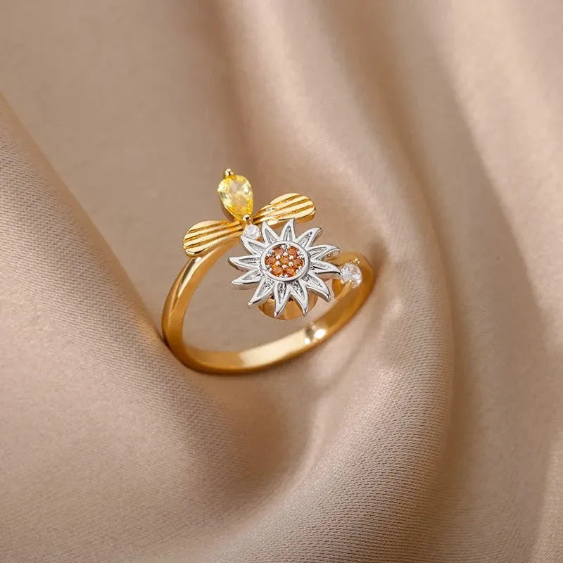 Simple geometric gold adjustable fidget ring with rotating band on a finger