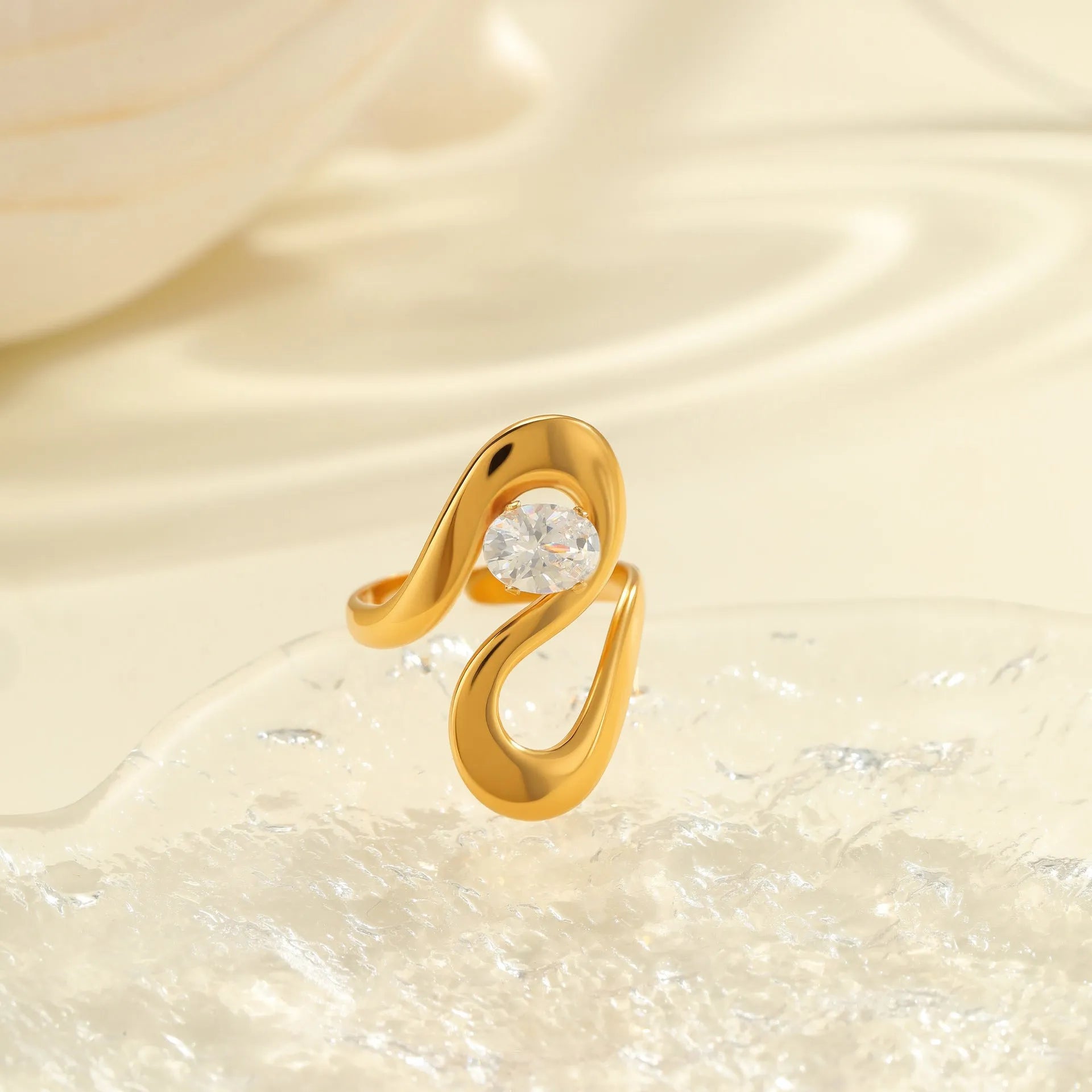 Adjustable stainless steel ring with geometric zircon shapes on a silver-toned band.