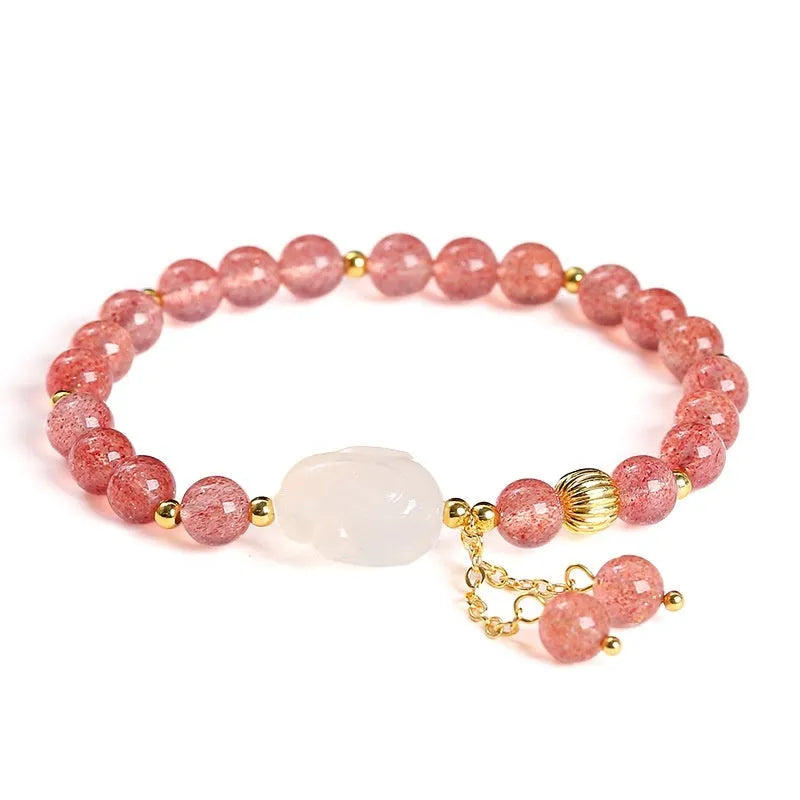 Handcrafted women's bracelet with strawberry quartz and agate beads featuring a white rabbit design.