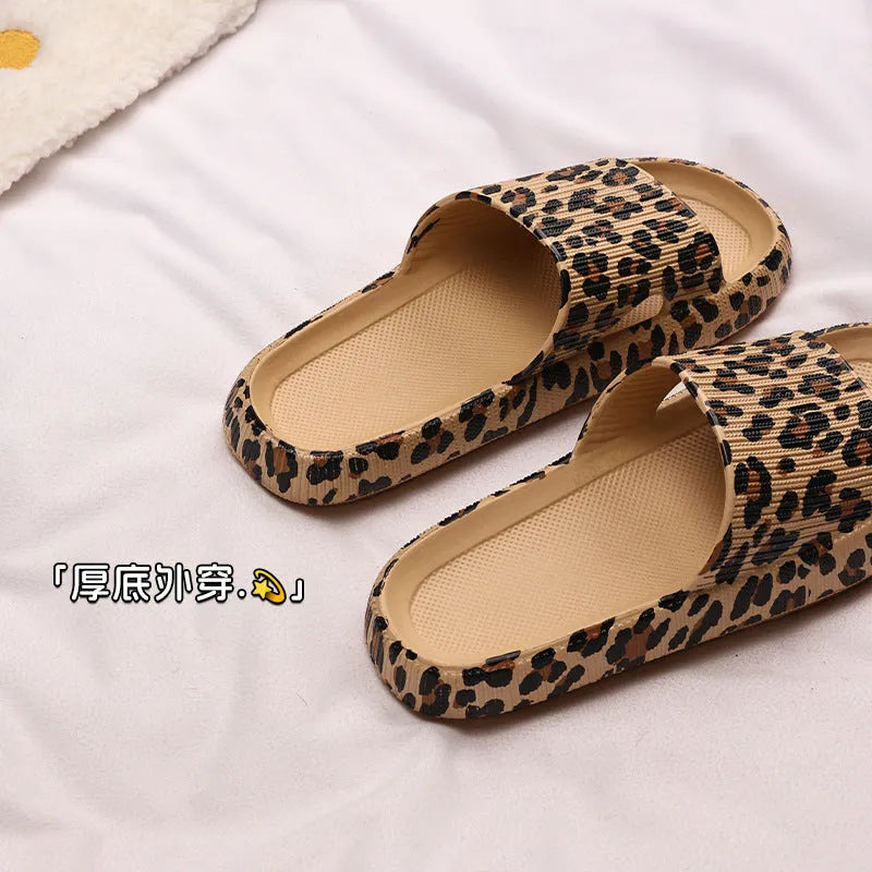 Leopard print slippers with thick EVA sole showing slip-on design and animal pattern details