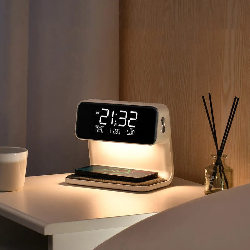 White bedside lamp with integrated wireless charging pad, LCD alarm clock screen, and touch-sensitive dimming controls.
