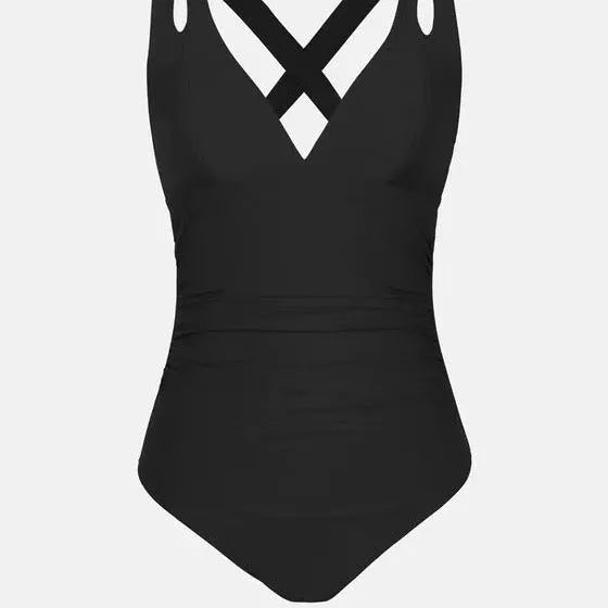 Solid colour one-piece triangle bikini swimsuit with cross shoulder straps on a model.