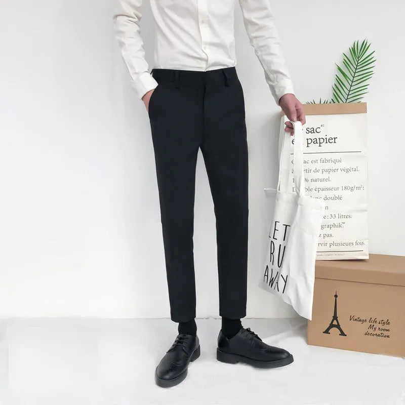 Men's straight-leg cotton trousers with drawstring waist in black, grey or khaki colours.