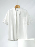 Men's loose fit linen short-sleeve shirt in a solid colour with a simple stand collar.