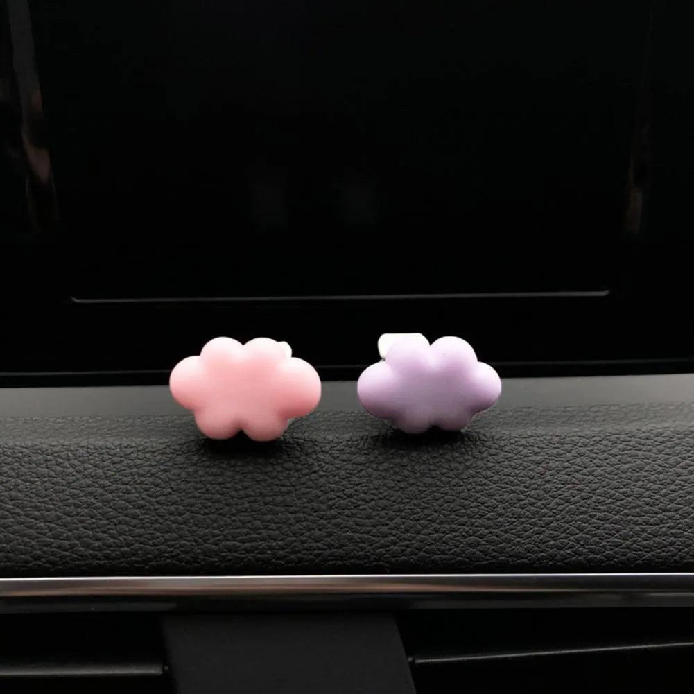 Resin cartoon car fragrance clip in light green colour, dimensions 17mm by 27mm, on a car air vent