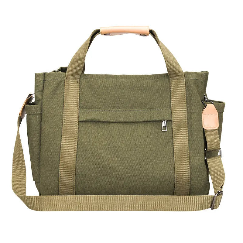Horizontal square canvas tote bag with side zipper compartments and internal organisation pockets