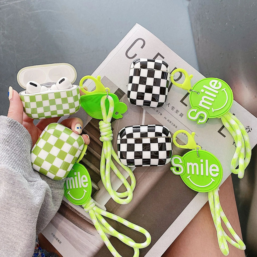 Checkerboard pattern TPU protective case cover for Apple AirPods charging case in black and green.