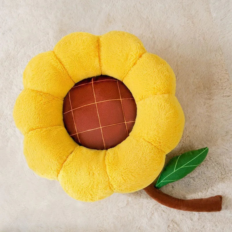 Soft yellow sunflower patterned pet nest cushion for cats and small dogs on a wooden floor.