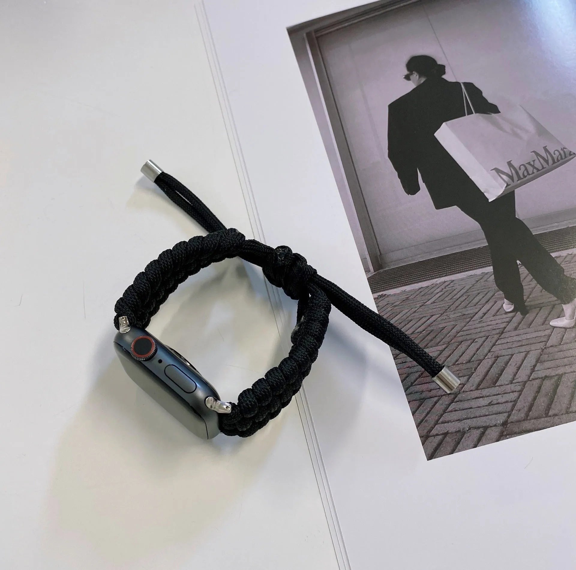 Black paracord braided smartwatch strap with buckle for Apple Watch and Samsung Huawei models.