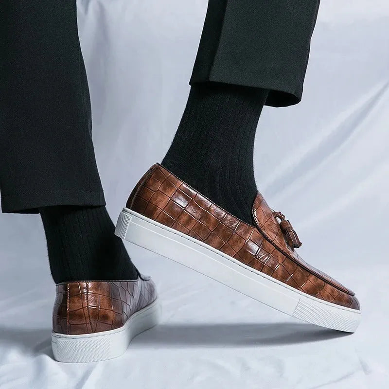 Men's black business casual sneakers with tassel detailing and round toe shape
