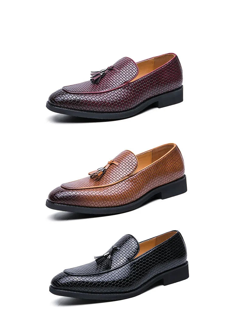 Men's black pointed slip-on leather shoes with tassel detailing on a low-top upper for business wear