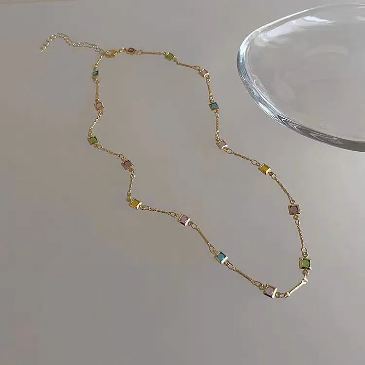 Square colour artificial crystal geometric pendant necklace on clavicle-length chain in gold tone