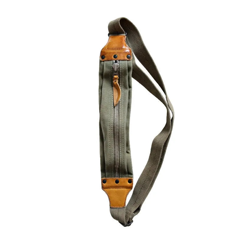 Green military style chest bag made from vintage canvas with cowhide leather accents and anti-theft design