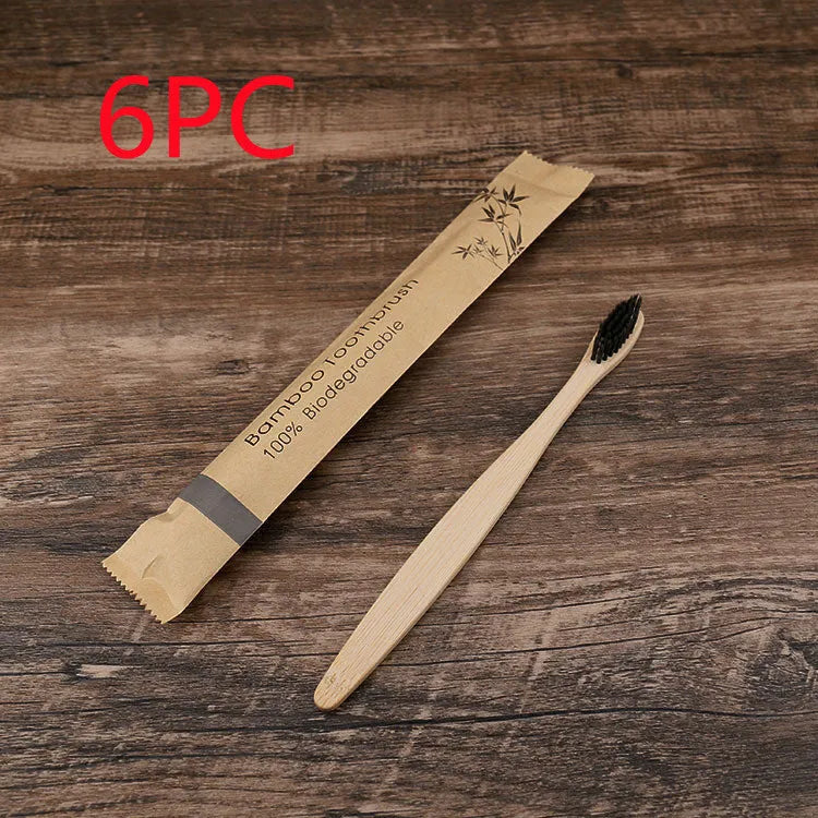 Set of 10 bamboo toothbrushes with charcoal bristles in various colours showing 17.5cm handles