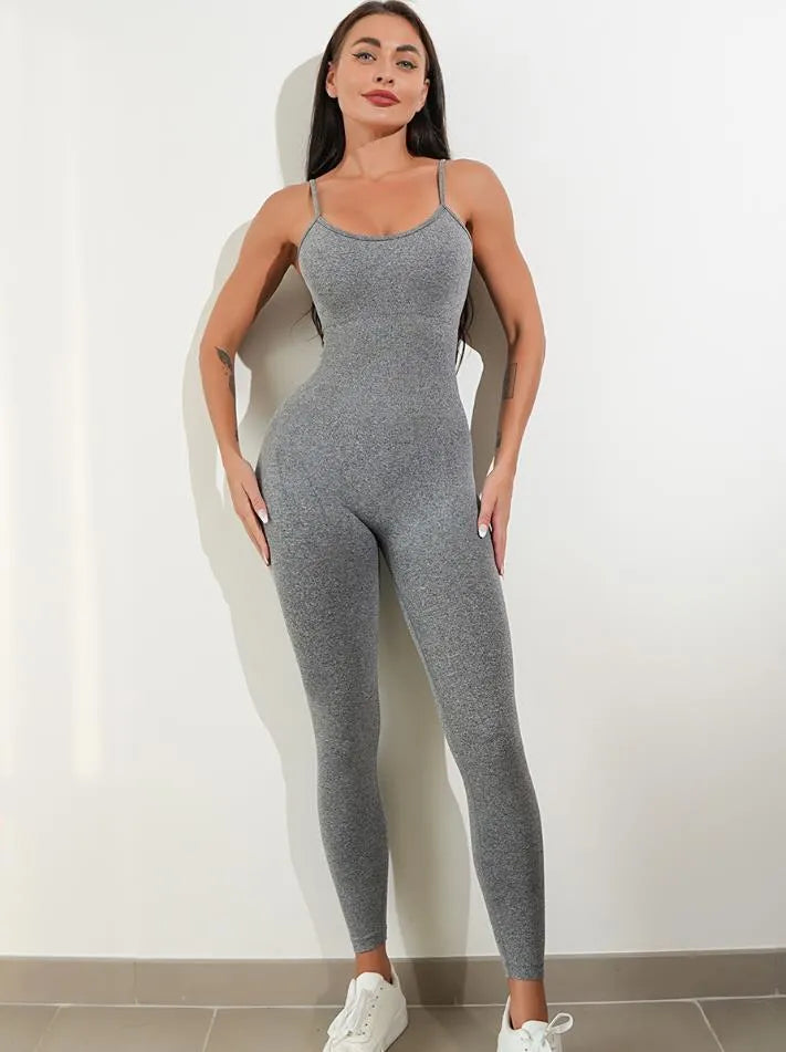 Women's black unitard jumpsuit with spaghetti straps and tummy control, made from nylon and spandex for stretch