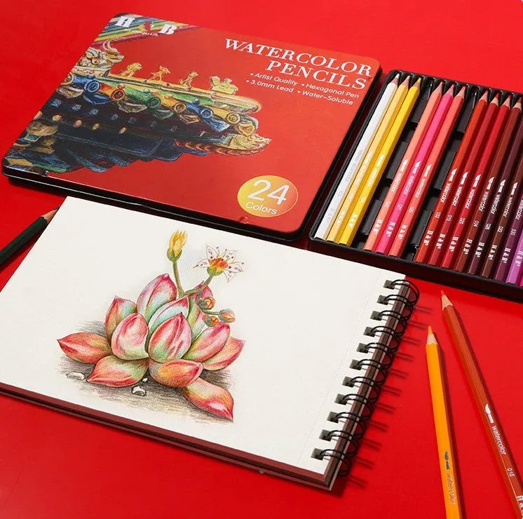 Metal tin box open to show 24 water-soluble coloured pencils in wooden casings.