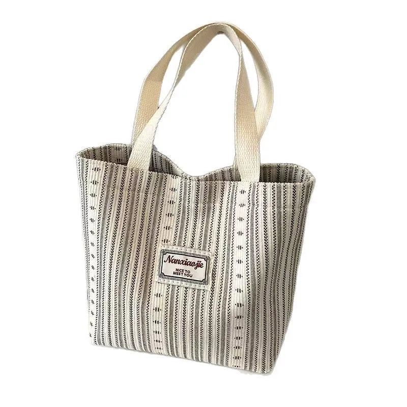 Japanese style large capacity corduroy handbag in dark brown, shown front view.