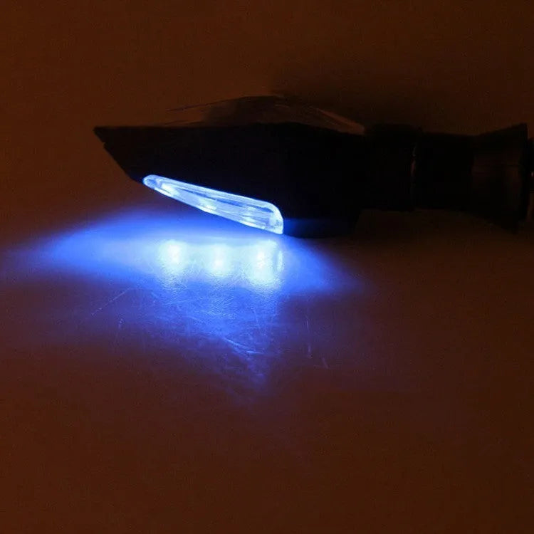 Motorcycle turn signal lights with plastic LED construction showing yellow and blue illumination
