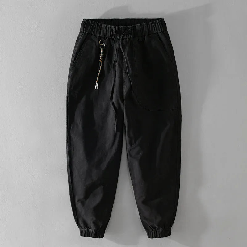 Men's cotton overalls with drawstring waist and ankle banded leg in army green colour.