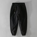 Men's cotton overalls with drawstring waist and ankle banded leg in army green colour.