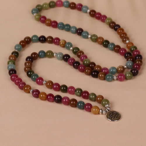108-bead adjustable multi-layer bracelet with lotus charm in tourmaline colour, made from alloy.