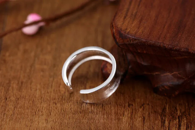 Geometric adjustable opening frosted sterling silver ring on finger