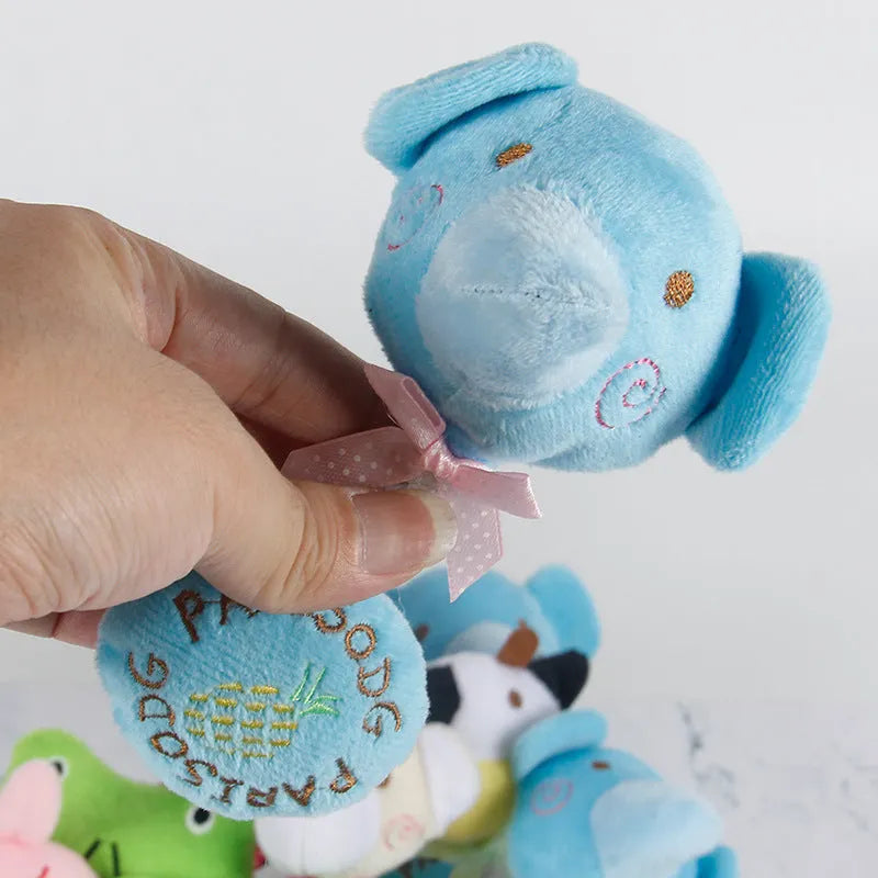 Plush dog toys with animal designs including frog, elephant, cow and bear with cotton rope sections