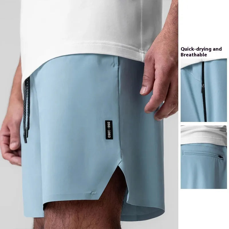 Men's grey seamless sports shorts with knee-length straight leg design and quick-dry fabric