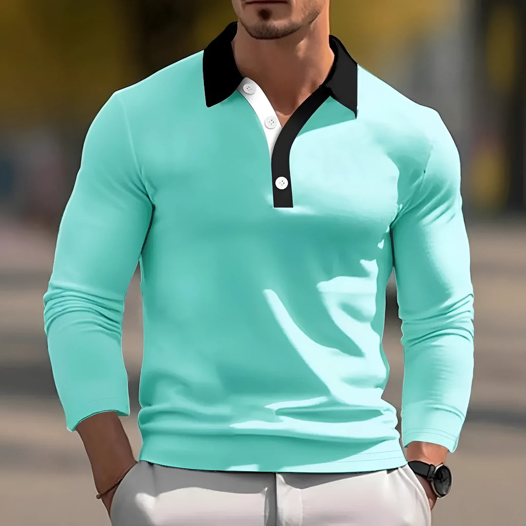 Man wearing a loose-fitting retro style long sleeve pullover top in a solid colour.
