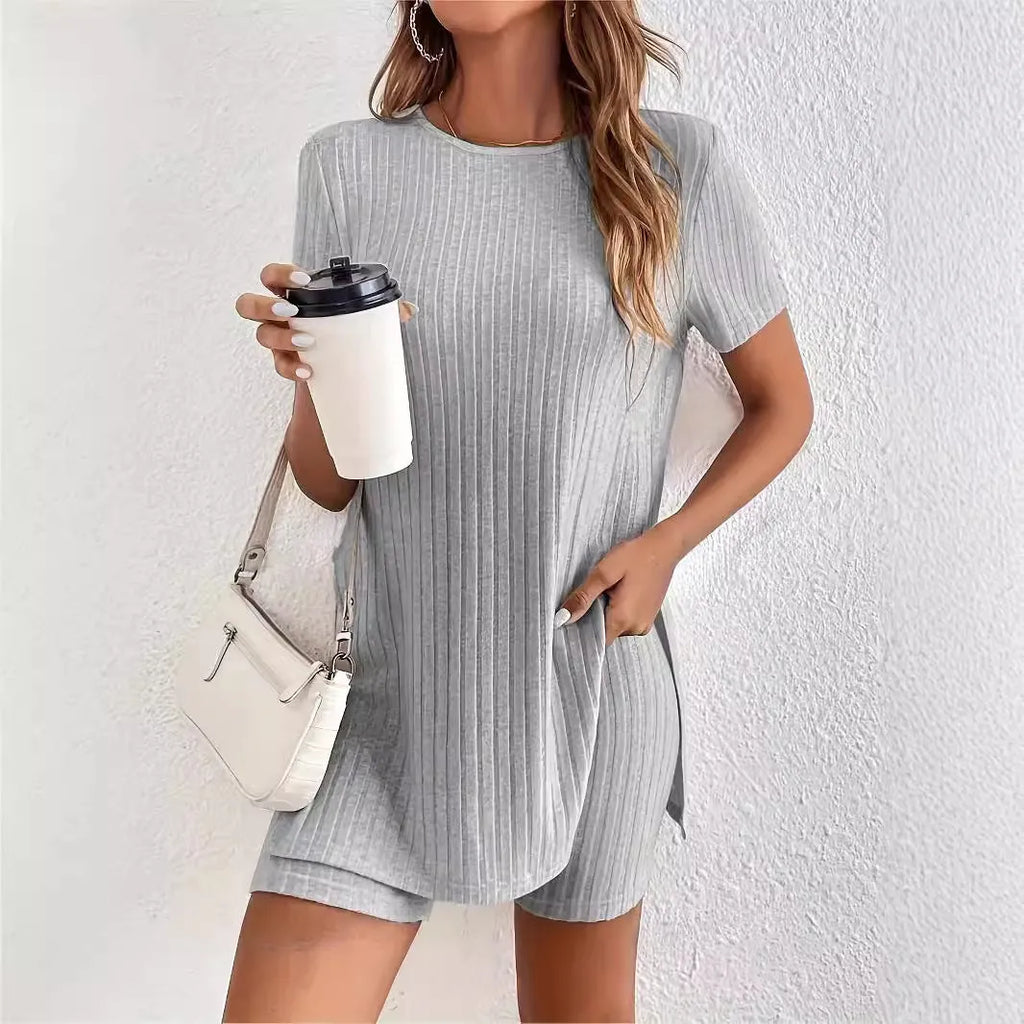 Women's black cotton two-piece shorts set with ribbed crew neck top and matching shorts on a hanger.