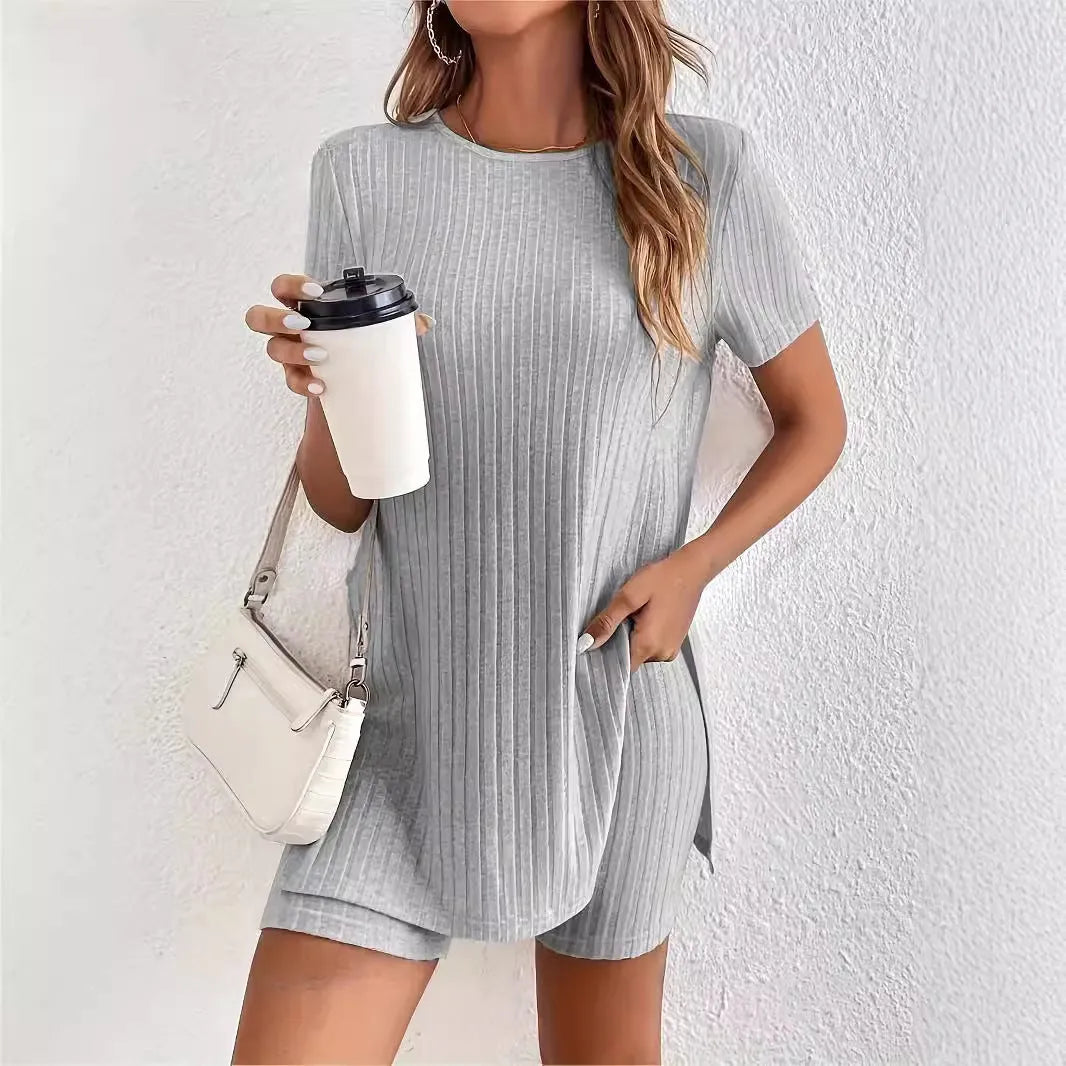 Women's black cotton two-piece shorts set with ribbed crew neck top and matching shorts on a hanger.