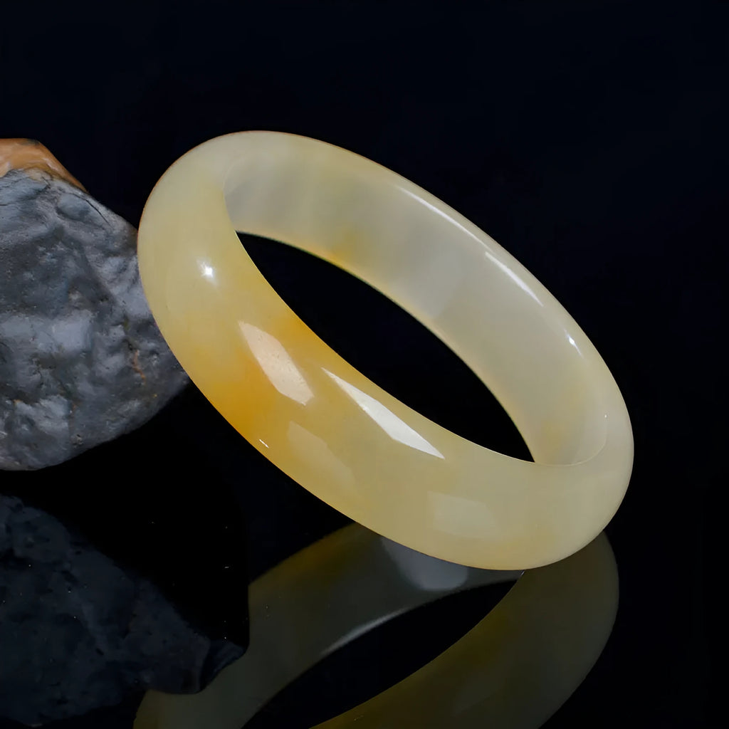 Natural light jade bracelet for women in Chinese style with polished finish on wrist