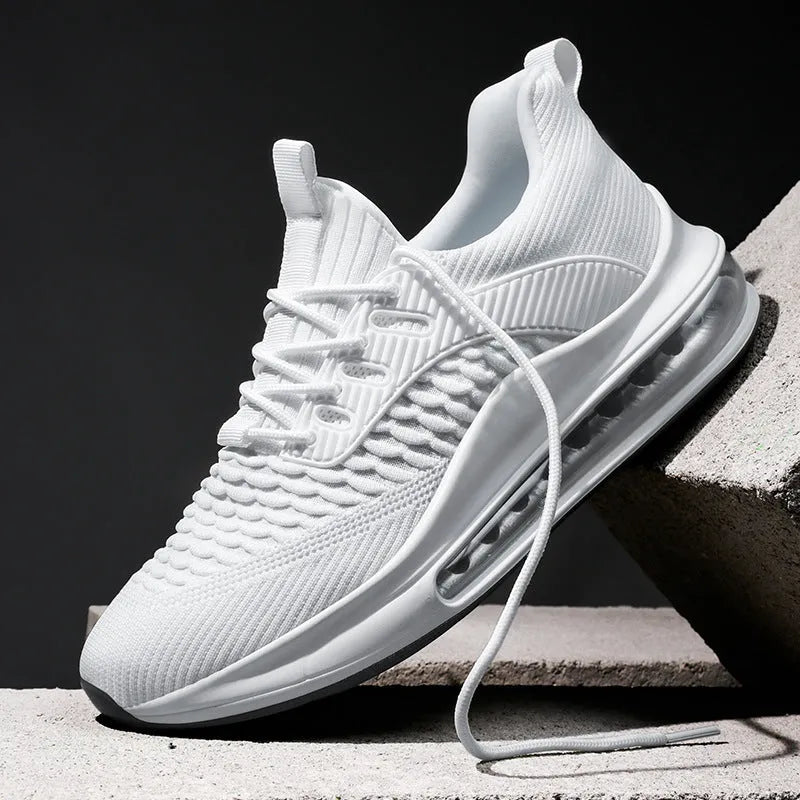 Black low-top mesh running sneakers with rubber sole, showing breathable construction and lace-up front